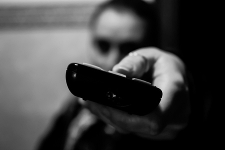 Remote control pointed at the cameraの写真素材