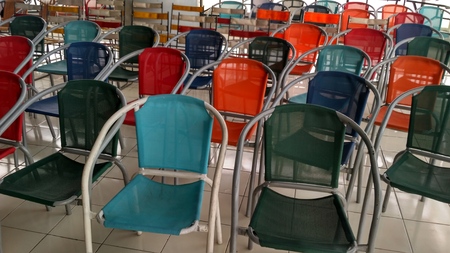 a row of colorful waiting chairsの写真素材