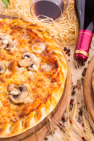 Mushroom tomato sauce pizza, oregano and grated cheeseの写真素材
