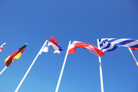 Flags set of masts on a background of blue sky