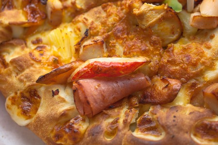 Closeup Shot of Pizza with Pineapple, Ham and Bell Pepperの写真素材