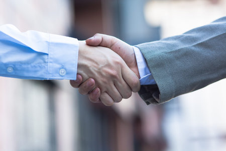 Business handshake. Two businessman shaking hands