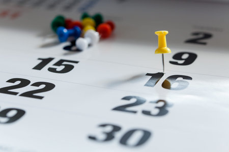 Pushpins on calendar, Busy and overworking days. Important date or meeting appointment reminder concept.の写真素材