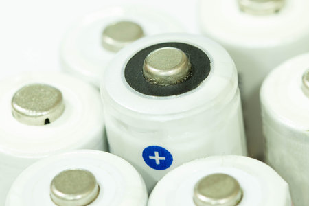 Pile of batteries stacked in a row together