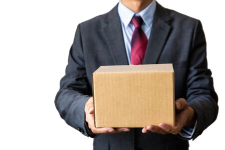 Young business man carrying empty box (with clipping path)の写真素材