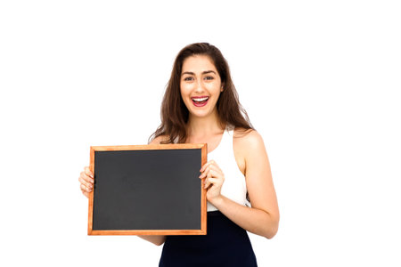 Beautiful Caucasian woman holding empty blackboard over white background - ready to fill text