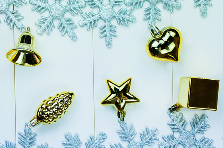 Seasonal Christmas ornaments and snowflakes on white wood background.の写真素材