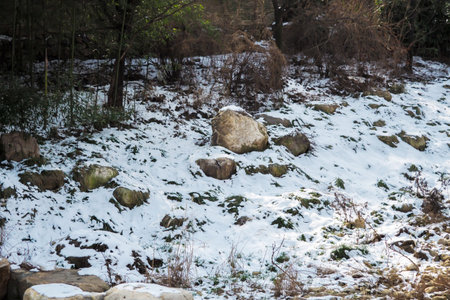 Pile of white snow on rocky surface ground in winterの写真素材