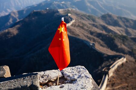 China flag waving over The Great Wall of China in the backgroundの写真素材