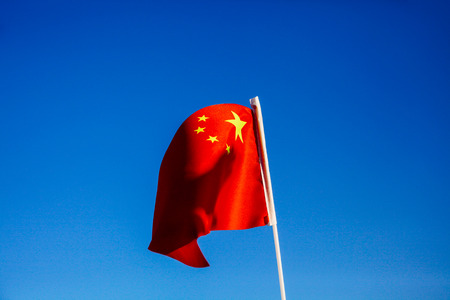 China flag waving over blue sky - country in Asiaの写真素材