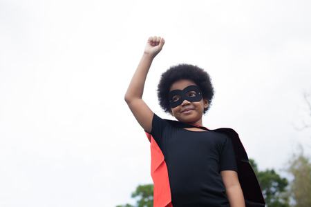 African American super hero child on launch stance - with copy spaceの写真素材