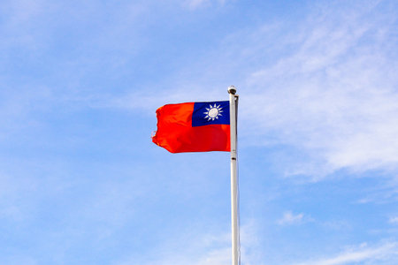 Taiwan or Republic of China flag waving over the blue sky