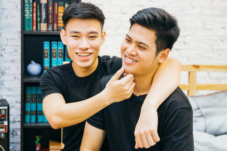 Asian gay couple spending time together at home. Portrait of happy gay men - Homosexual love conceptの写真素材