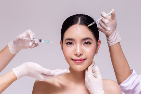 Mixed Asian young 20s woman going through skin care and aesthetic medical therapy and to be injected...