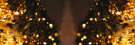 Gold blurry defocused bokeh Christmas tree on two sides - with copy space used for banner