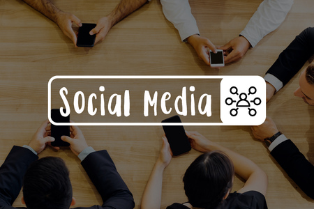 Group of business people putting hands together on desk with full of analysis papers - Social Media wordの写真素材