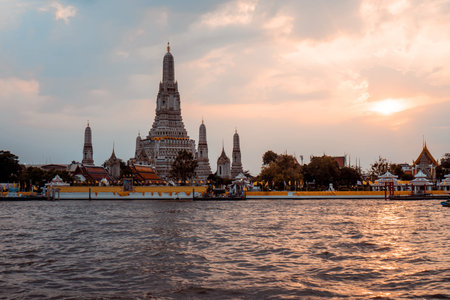 Beautiful twilight landscape view of Wat Arun Ratchawararam temple in Thailand. Tourist spot landmark of Bangkok during sunsetの写真素材