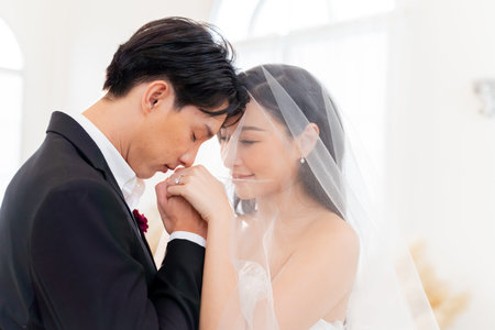 Bride and groom showcase their rings, a close-up view., symbolizing eternal love and commitment - wedding ceremony conceptの写真素材