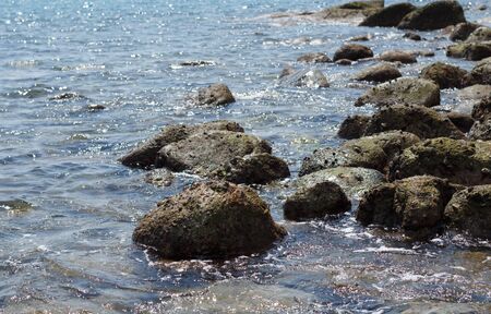 Sea landscape. Evening on the stone beach.の写真素材