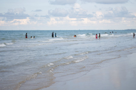 happy family playing in seaの写真素材