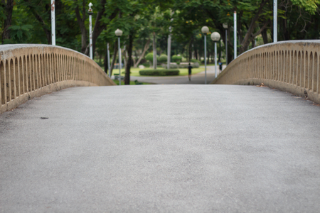 Concrete footbridge with artificial branch railingの写真素材