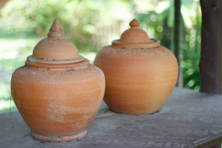 Ancient jar. Thailand in ancient times,earthen jar filled with water placed in front of a home for people who commute to drink.の写真素材