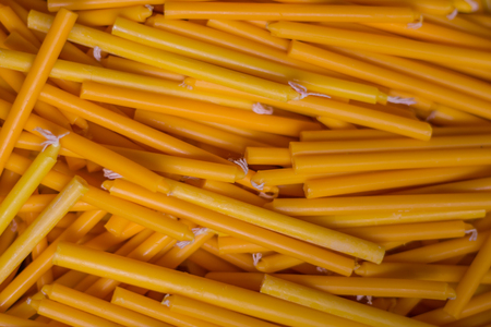 yellow candles for religious ceremony, candle light.の写真素材