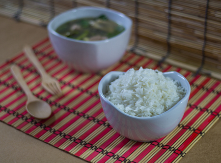 clear soup with pork, vegetable and riceの写真素材