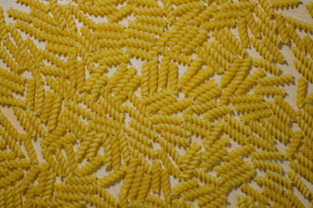 Dried pasta on wooden background. Italian food concept.の写真素材