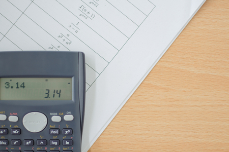 Calculator and sheet of paper with maths-formulasの写真素材