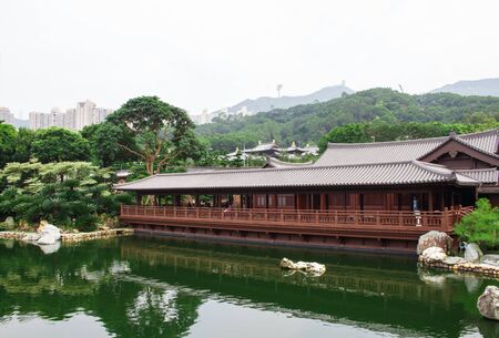 Antique wooden houses on the lake and garden.の写真素材