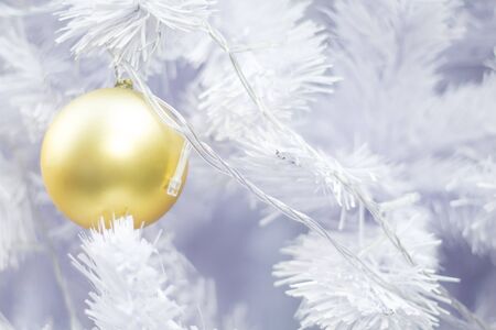 Beautiful decorated snowy fir christmas trees with colorful balls.の写真素材