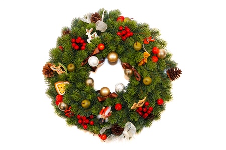 Christmas Decoration with pine cones, ornaments, baubles, apples, wooden horses, nutcracker and other toys の写真素材