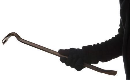 thief or burglar with crowbar isolated on white backgroundの写真素材