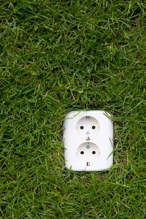 energy concept outllet in grassの写真素材