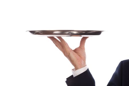 waiter with a silver plate .Isolated on a white background focus on handの写真素材