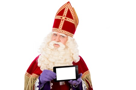 Saint Nicholas with smart phone or tablet. Isolated on white backgroundの写真素材