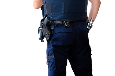 Police officer, with gun belt, handcuffs phone and pepper-spray. Isolated on white background