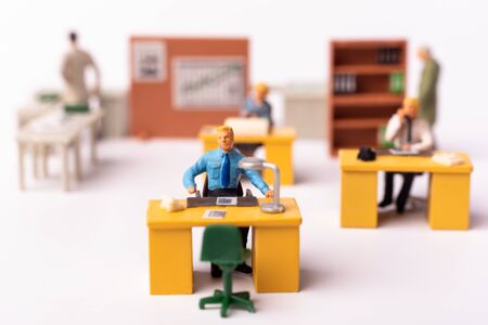 Miniature businesspeople team at the office. Macro shot of Tiny people business concept. Shallow Dept Of Fieldの写真素材