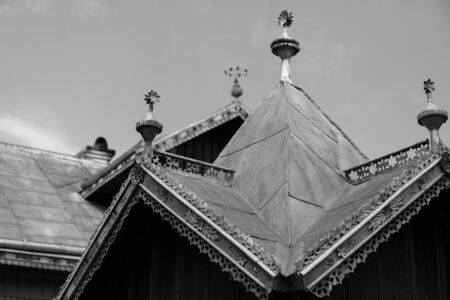 Decorated metal roof. Tin roof with ornaments. Traditional house in Maramures Romaniaの写真素材