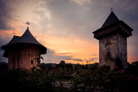 GURA HUMORULUI, ROMANIA - August 14 2019: The orthodox monastery Humor at sunset. UNESCO World Heritage Site. Suceava county, Romania.のeditorial素材