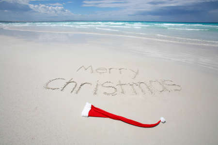 Merry Christmas written on a tropical beachの写真素材