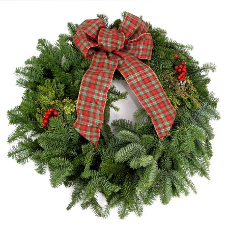 Beautiful, fresh holiday wreath with pine boughs and a bow                               の写真素材