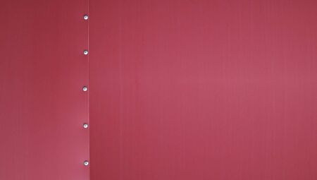 Burgandy sheet metal from a trailer with rivet detail                               の写真素材