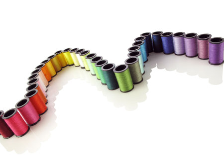Very colorful rainbow of sewing thread forms a nice curve on white                               の写真素材