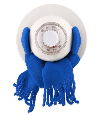 Chilly thermostat with earmuffs and a scarf to keep toasty warm                               の写真素材