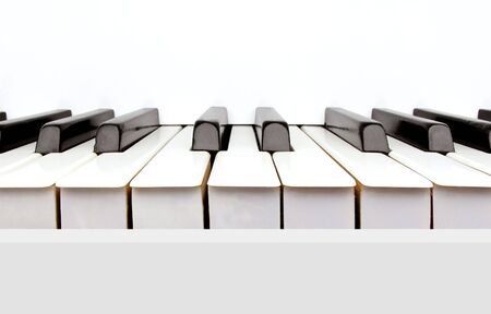 Black and white keys of a vintage white pianoの写真素材