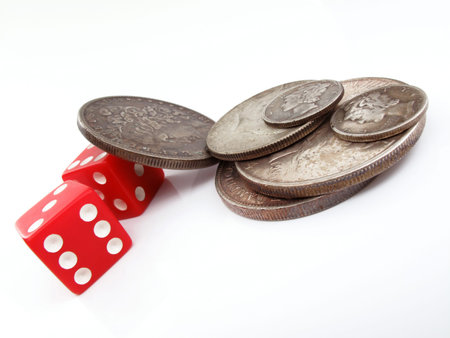 silver coins and red diceの写真素材