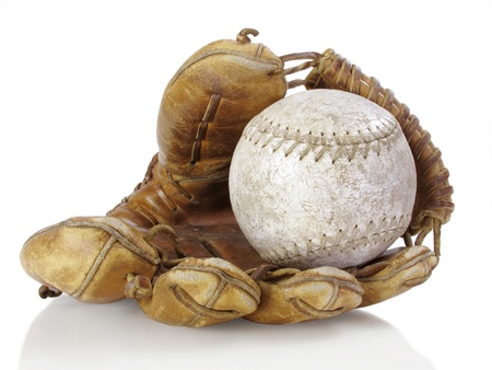 Well-used catcher's mitt with tattered softballの写真素材