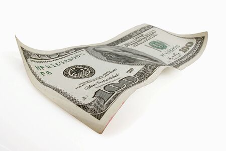 One hundred dollar bill appears to floa on whiteの写真素材